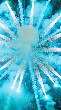Vertical video: Launching fireworks igniting core burst, sending radial sparks, teal smoke for show