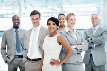 Fototapeta premium Smile, portrait or business people with group in lobby for career, about us or financial conference. Consultant, team and proud advisor in office with ambition, corporate event or opportunity