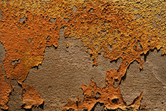 Peeling paint texture background with rustic orange cracked cement wall backdrop.