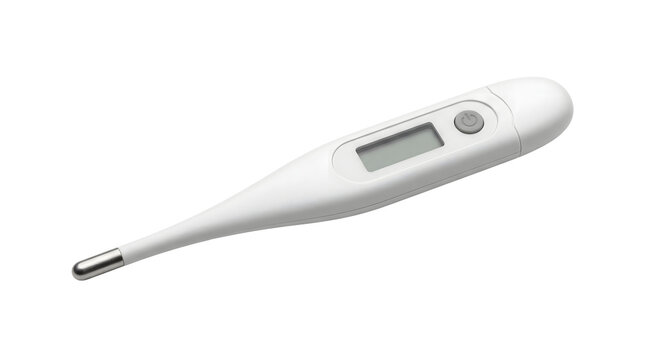 A digital thermometer lies on a surface in a clinical setting.