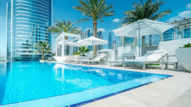 Luxury rooftop swimming pool with sun loungers and parasols in modern cityscape on sunny day