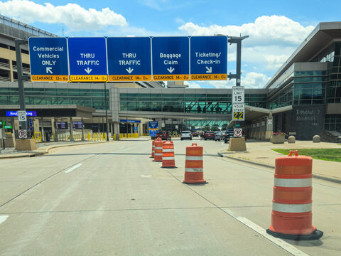 Minneapolis, USA - Jun 15, 2026: Roadway entrance to Minneapolis-Saint Paul International Airport (MSP) with signs and traffic barrels. Editorial Use ONly.