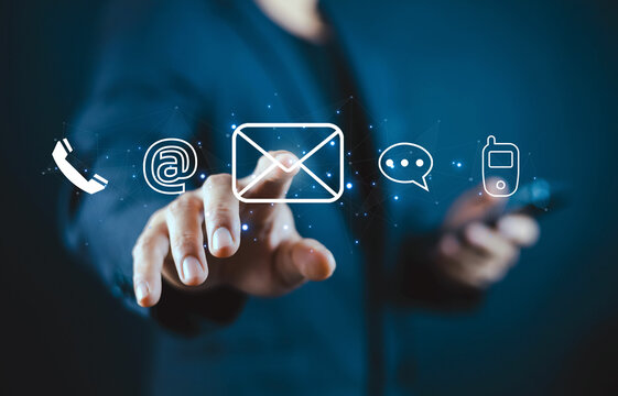 Business professional using a virtual communication interface with email, phone, messaging, and mobile icons, representing digital communication, business technology, online connectivity.