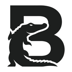 Fototapeta premium Black silhouette of a crocodile climbing up a large letter B animal and alphabet concept