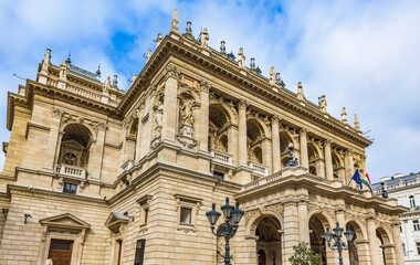 Fototapeta premium Exterior view of the historic Hungarian State Opera House (Magyar Allami Operahaz) in Budapest. The Neo-Renaissance facade, People walk by on Andrassy Avenue.