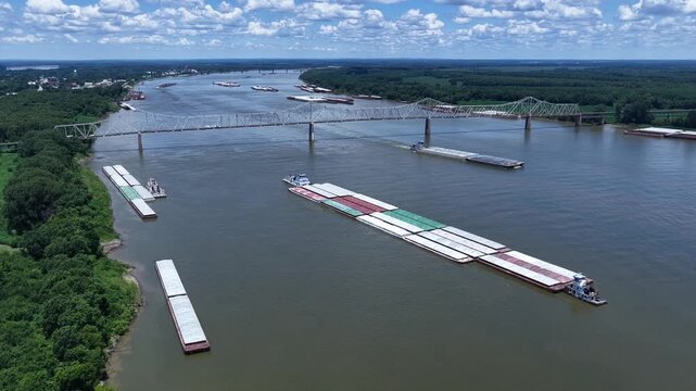 Ohio river tugboat barge traffic transport of consumer and industrial products at Mississippi, Ohio River Confluence