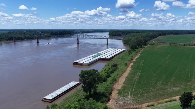 Mississippi River with iron bridge and barges at Mississippi, Ohio River Confluence