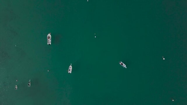 Aerial top-down view of a boat on clear water at Chausey, Normandy, France