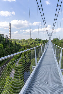 Suspension bridge Neckarline over Neckar river and TK Elevator Test Tower in Rottweil, Germany