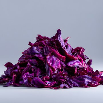 Sliced red cabbage forming a pile, highlighting its vibrant purple color and fresh texture