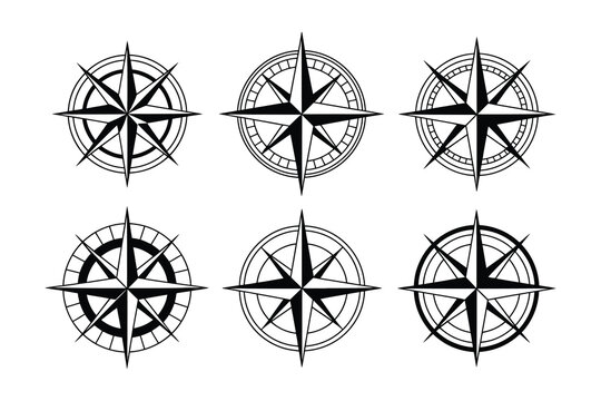 Collection of six different black compass rose navigation symbols on white background  used for direction and orientation