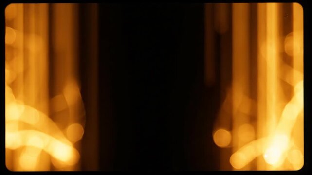 Abstract Golden Light Beams with Bokeh Effect.