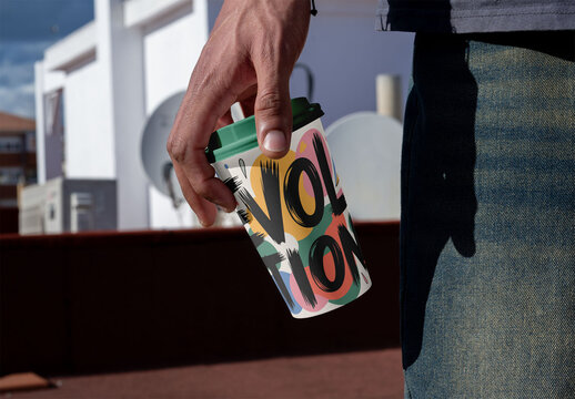 Mockup of Hand Holds take away Cup on Rooftop