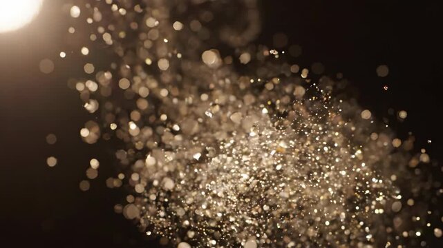 Dynamic Glitter Particles in Motion for Celebration and Festive Events.