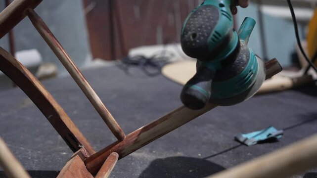 Furniture restoration process, woman repairing a classic wooden chair