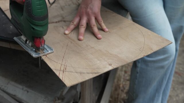 Female craftsperson restoring a worn wooden chair, antique furniture renovation, woodworking and sustainable reuse