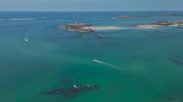 Aerial view of a boat moving across the sea near Chausey, Normandy, France
