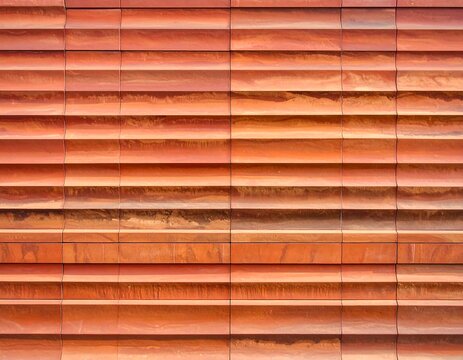 A close-up view of a rusty metal wall with horizontal ridges