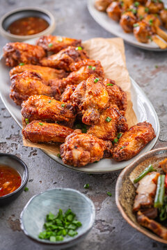 Delicious crispy fried chicken wings served with rice and dipping sauces