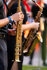 Obraz premium Young musician performing on a saxophone during a vibrant street concert in spain