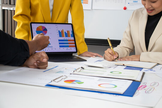 Meeting businessman and consultants are discussing analysis of market growth charts and increasing company profits. Strategy analysis and business planning.