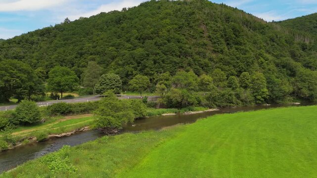 Panning Drone Shot of Sauer River and Green Valley