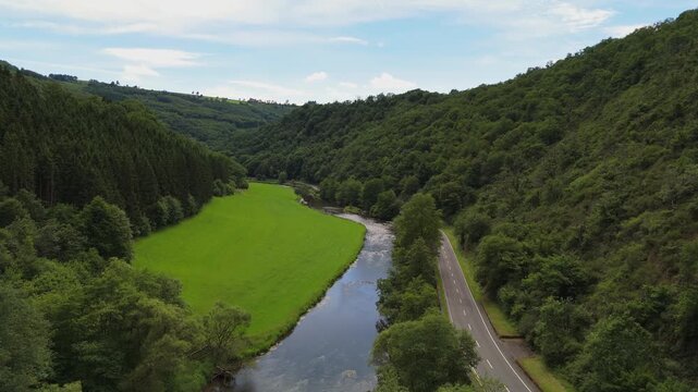 Aerial View of Scenic River Valley and Country Road