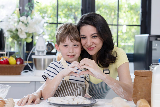 Family spends time together in a kitchen