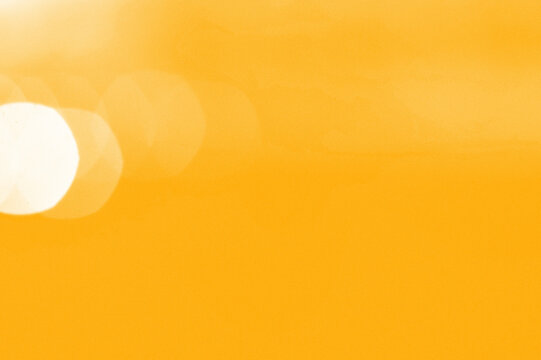 Abstract Yellow Background With Out Of Focus Circles And Bokeh Effect