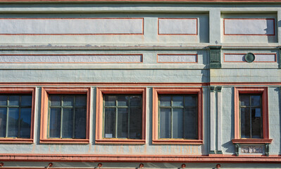 Obraz premium Mint Green and Orange Faded Victorian Apartment Building.