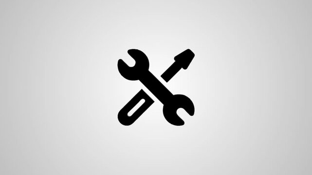 A motion graphic of a wrench and screwdriver forming a cross then transforming into a flat, simple icon on a light background