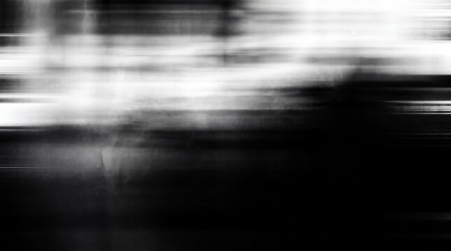 Abstract monochrome horizontal motion blur texture with high contrast light streaks and dark atmospheric gradients for cinematic visual backgrounds