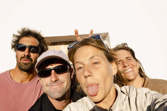 UGC funny selfie of four friends pulling faces on roadtrip