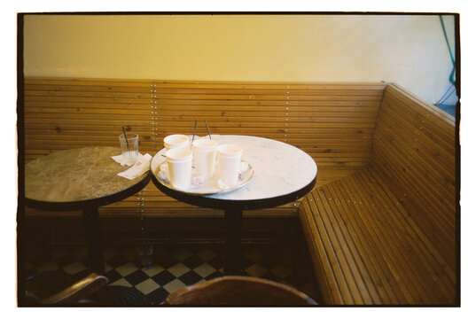 Empty tables with drinks waiting in a quiet cafe