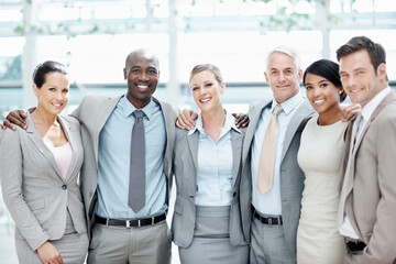 Fototapeta premium Corporate, portrait and business people hug in lobby for team, partnership and about us for insurance. Professional, happy and men with woman for company pride, trust and assurance for broker service