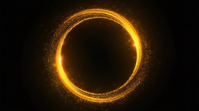 Golden glitter particles forming a sparkling circle frame on a dark background
