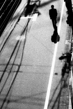 Man Walking with Dramatic Shadow on Tokyo Street
