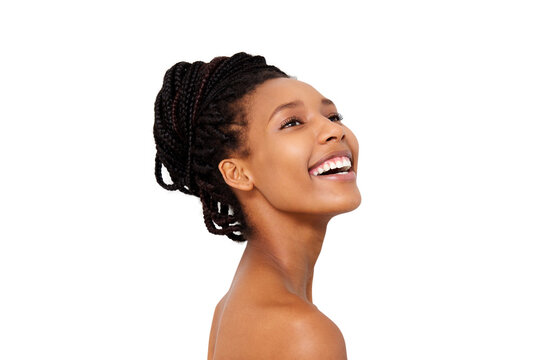 Close up pretty african woman looking away and smiling with naked shoulders