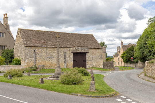 18th Century cotswold stone with slate roof and War Memorial in Hillesley, Gloucestershire, Uk. View of the crossroads and the War Memorial.