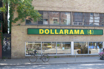Obraz premium exterior building and sign of Dollarama located at 1139 College St, Toronto