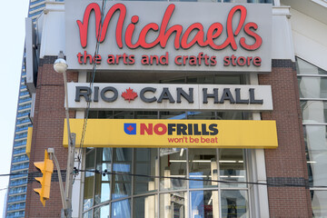 Obraz premium signs outside RioCan Hall including Michaels, NoFrills, and property management company, 126 John St, Toronto