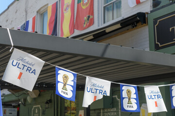 Obraz premium international soccer tournament sponsor bunting outside Ladybug Tavern, 890 College St, toronto