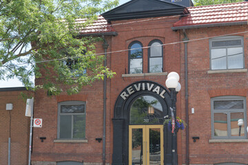 Obraz premium exterior building facade and sign of Revival Event Venue located at 783 College St, Toronto