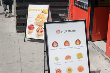 Obraz premium fruit mochi a-frame sidewalk signs in Kensington Market, Toronto
