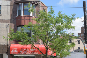 Obraz premium exterior building facade and sign of Grace Meat Market, a butcher shop, located at 644 College St, Toronto