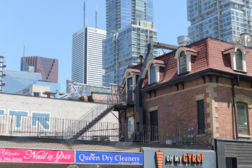 Obraz premium exterior building and signs of Ye Perfect Nails & Spa (159 John St), directly beside Queen Dry Cleaners (157 John St) and next to Oh My Gyro (155 John St), Toronto