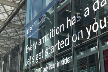 Obraz premium vinyl sign on the glass curtain wall of CIBC Square building at 81 Bay St, Toronto