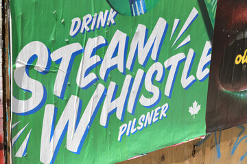 Obraz premium street wheatpaste poster for Steam Whistle pilsner in Toronto