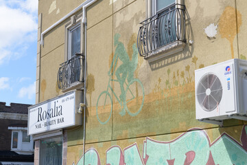 Obraz premium mural on the east side of a commercial property at 1264 Bloor St W, location of Rosalia Nail & Beauty Bar, Toronto