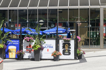 Obraz premium patio space outside The Pint Public House decked out with FIFA World Cup banners and signs including Soccer Canada and Michelob Ultra, 277 Front St W, Metro Convention Centre, Toronto